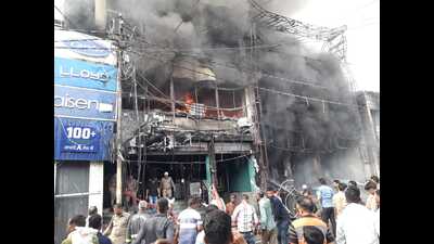 A major fire engulfed two showrooms of electronic items in building in Jhansi’s Sipri Bazar on July 3. (HT Photo) A major fire engulfed two showrooms of electronic items in building in Jhansi’s Sipri Bazar on July 3. (HT Photo)