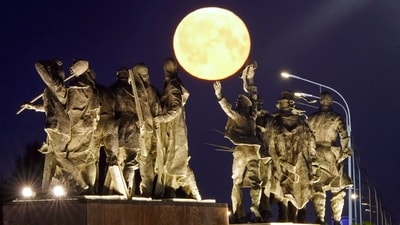 A super moon rises behind a Soviet-era monument for defenders of Leningrad, now St. Petersburg, in World War II, in St. Petersburg, Russia, early Tuesday, July 4, 2023. AP/PTI(AP07_04_2023_000005B) (AP) A super moon rises behind a Soviet-era monument for defenders of Leningrad, now St. Petersburg, in World War II, in St. Petersburg, Russia, early Tuesday, July 4, 2023. AP/PTI(AP07_04_2023_000005B) (AP)