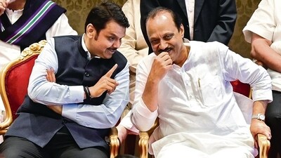 BJP leader Devendra Fadnavis and NCP leader Ajit Pawar at Raj Bhavan in Mumbai on Sunday. (Anshuman Poyrekar/HT Photo) BJP leader Devendra Fadnavis and NCP leader Ajit Pawar at Raj Bhavan in Mumbai on Sunday. (Anshuman Poyrekar/HT Photo)