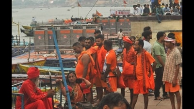 Kanwariyas taking holy dip in the Ganga river on the first day of sawan, at Dashashwamedh Ghat in Varansai on Tuesday. (RAJESH KUMAR)