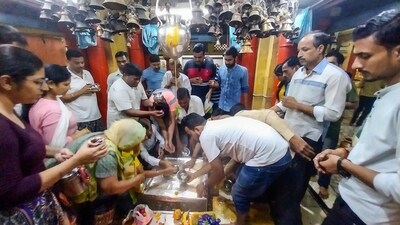 Devotees offer prayers to Lord Shiva at Bankhandeshwar temple on the first day of the Shravan month in Kanpur. (PTI) Devotees offer prayers to Lord Shiva at Bankhandeshwar temple on the first day of the Shravan month in Kanpur. (PTI)