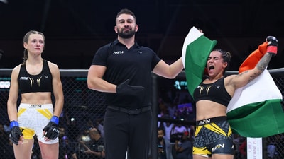 Puja Tomar (L) celebrates
