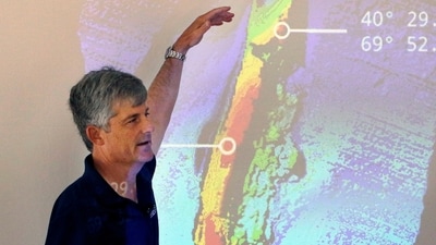 Stockton Rush speaks in front of a projected image of the wreckage of the ocean liner SS Andrea Doria during a presentation on their findings after an undersea exploration (AP Photo/Bill Sikes, File) (AP) Stockton Rush speaks in front of a projected image of the wreckage of the ocean liner SS Andrea Doria during a presentation on their findings after an undersea exploration (AP Photo/Bill Sikes, File) (AP)