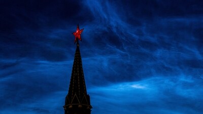 Noctilucent clouds are seen over the tower of Moscow's Kremlin in Russia. (Reuters)
