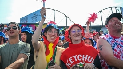 <p>People dawn American Flags as capes during the Fishtown Horrible's Parade in Gloucester, Massachusetts.</p> (AFP)