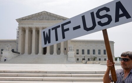 A demonstrator protests outside the U.S. Supreme Court as the court made their final rulings of their session on the issues of student loan forgiveness and LGBTQ rights in Washington, U.S. June 30, 2023.  REUTERS/Jim Bourg (REUTERS)