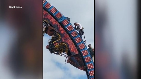 Crews working to get the riders down to safety. (Image Credit: Scott Brass/Facebook)