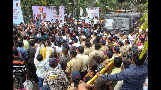 Both Ajit Pawar and Sharad Pawar groups of NCP supporters at party office in Nashik on Tuesday. (PTI)