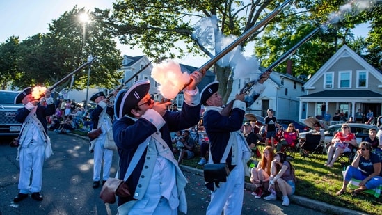 Colonial reenactors fire their weapons during the Fishtown Horrible's Parade in Gloucester, Massachusetts.(AFP)
