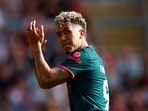 Roberto Firmino applauds fans as he walks to be substituted after playing his last game for Liverpool