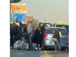 South Africa: In the video, the officers were seen holding rifles and dragging the man across the road. South Africa: In the video, the officers were seen holding rifles and dragging the man across the road.