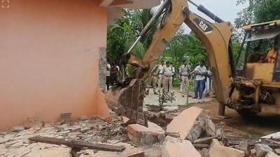 A bulldozer was sent to Pravesh Shukla’s house by Sidhi administration to demolish the portion that was constructed in violation of the rules. (Video/Screengrab) A bulldozer was sent to Pravesh Shukla’s house by Sidhi administration to demolish the portion that was constructed in violation of the rules. (Video/Screengrab)