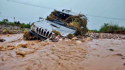 A car swept away in the water after flash floods occurred due to heavy monsoon rainfall in Una district on Wednesday. (PTI) A car swept away in the water after flash floods occurred due to heavy monsoon rainfall in Una district on Wednesday. (PTI)