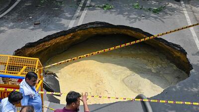 A large portion of road caved in at Janakpuri on Wednesday. Nobody was hurt in the incident. (Vipin Kumar/HT Photo) A large portion of road caved in at Janakpuri on Wednesday. Nobody was hurt in the incident. (Vipin Kumar/HT Photo)