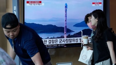 A TV screen shows a file image of North Korea's rocket launch during a news program, at the Seoul Railway Station in Seoul. (AP) A TV screen shows a file image of North Korea's rocket launch during a news program, at the Seoul Railway Station in Seoul. (AP)