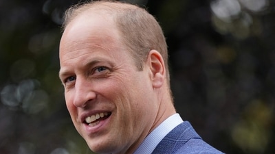 Britain's Prince William, Prince of Wales reacts. (AFP)