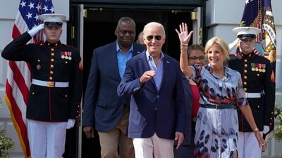 President Joe Biden and first lady Jill Biden, followed by Defense Secretary Lloyd Austin and his wife Charlene Austin, walk out to the South Lawn of the White House in Washington, Tuesday, July 4, 2023, during a barbecue with active-duty military families to celebrate the Fourth of July. (AP Photo/Susan Walsh) (AP) President Joe Biden and first lady Jill Biden, followed by Defense Secretary Lloyd Austin and his wife Charlene Austin, walk out to the South Lawn of the White House in Washington, Tuesday, July 4, 2023, during a barbecue with active-duty military families to celebrate the Fourth of July. (AP Photo/Susan Walsh) (AP)