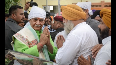 Jammu and Kashmir Lt Governor Manoj Sinha interacts with Sikh devotees visiting the Chatti Padshahi Gurduwara on the occasion of Guru Hargobind Singh's birth anniversary, in Srinagar on Wednesday. (PTI)