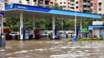 Surat: A waterlogged petrol pump following heavy rainfall, (PTI) Surat: A waterlogged petrol pump following heavy rainfall, (PTI)