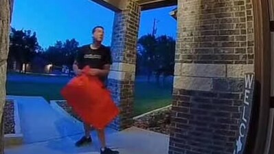A viral video shows the shocking moment a pizza delivery man verbally attacked a Texas woman for giving him a $5 tip (ladybug3660/TikTok) A viral video shows the shocking moment a pizza delivery man verbally attacked a Texas woman for giving him a $5 tip (ladybug3660/TikTok)