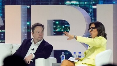 Ex-Twitter CEO Elon Musk, center, speaks with Linda Yaccarino, (AP) Ex-Twitter CEO Elon Musk, center, speaks with Linda Yaccarino, (AP)