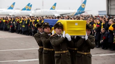 Soldiers carry a coffin containing the remains of one of the eleven Ukrainian victims of the Ukraine International Airlines flight 752 plane disaster during a memorial ceremony at the Boryspil International Airport, outside Kiev. (Reuters)
