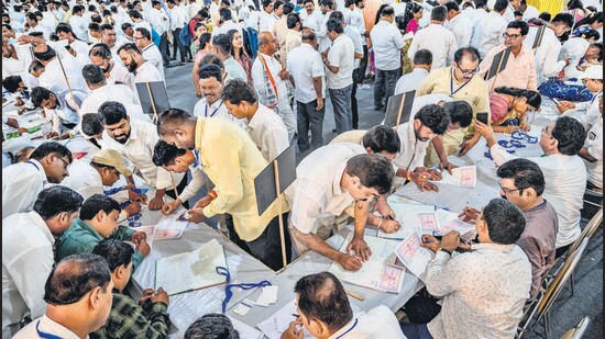 Mumbai, India - July 5, 2023: Ajit Pawar supporters filling registration form before starting meeting at MET, Bandra, in Mumbai, India, on Wednesday, July 5, 2023. (Photo by Satish Bate/ Hindustan Times) (Hindustan Times)