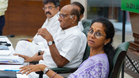 Nationalist Congress Party (NCP) president Sharad Pawar with party leader Supriya Sule during party office bearers' meet, (PTI file)