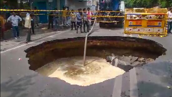 Visuals of the caved-in road in Janakpuri on Wednesday. (PTI Photo)