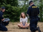 Greta Thunberg: Police officers talk to the Swedish climate activist Greta Thunberg.