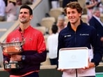 Serbia's Novak Djokovic (L) and Norway's Casper Ruud pose with their trophies after their French Open 2023 final. Serbia's Novak Djokovic (L) and Norway's Casper Ruud pose with their trophies after their French Open 2023 final.