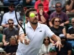 Stan Wawrinka returns the ball to Argentina's Tomas Martin Etcheverry during 2023 Wimbledon Championships Stan Wawrinka returns the ball to Argentina's Tomas Martin Etcheverry during 2023 Wimbledon Championships