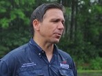 U.S. Republican presidential candidate Florida Governor Ron DeSantis talks to reporters after walking in the Fourth of July Parade in the rain in Merrimack, New Hampshire, U.S., July 4, 2023.  