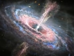 This artist's concept shows a galaxy with a brilliant quasar, a very bright, distant and active supermassive black hole that is millions to billions of times the mass of the Sun, at its center, seen in this undated handout picture. NASA, ESA and J. Olmsted (STScI)/Handout via REUTERS (via REUTERS)