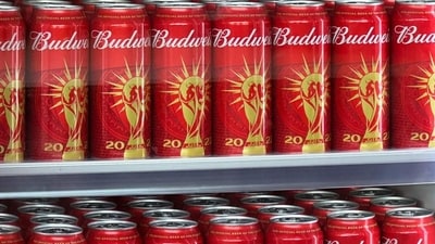 Budweiser, owned by Anheuser-Busch InBev, faces backlash after Fourth of July ad criticized as "misogynistic" due to previous controversy with Bud Light and transgender influencer Dylan Mulvaney. (AFP) Budweiser, owned by Anheuser-Busch InBev, faces backlash after Fourth of July ad criticized as "misogynistic" due to previous controversy with Bud Light and transgender influencer Dylan Mulvaney. (AFP)