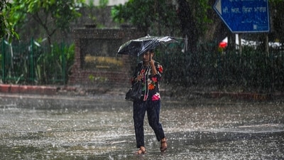 Commuters move during heavy rains at Rajinder Nagar in New Delhi, India. (Photo by Sanchit Khanna/ Hindustan Times) Commuters move during heavy rains at Rajinder Nagar in New Delhi, India. (Photo by Sanchit Khanna/ Hindustan Times)