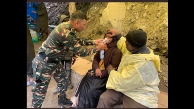 Inspector general of CRPF Ajay Yadav on Thursday rescues an Amarnath Yatra woman pilgrim. (HT photo) Inspector general of CRPF Ajay Yadav on Thursday rescues an Amarnath Yatra woman pilgrim. (HT photo)