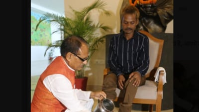 MP CM Shivraj Singh Chouhan washed feet of urination victim (Twitter/@ChouhanShivraj) MP CM Shivraj Singh Chouhan washed feet of urination victim (Twitter/@ChouhanShivraj)