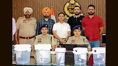 Police officials with the seized weapons in Ludhiana. (HT PHOTO) Police officials with the seized weapons in Ludhiana. (HT PHOTO)