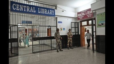 Security personnel stand guard as crime branch raids GMCH principal and dean’s office in Jammu on Thursday. (ANI) Security personnel stand guard as crime branch raids GMCH principal and dean’s office in Jammu on Thursday. (ANI)