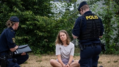 Greta Thunberg: Police officers talk to the Swedish climate activist Greta Thunberg. (AP) Greta Thunberg: Police officers talk to the Swedish climate activist Greta Thunberg. (AP)