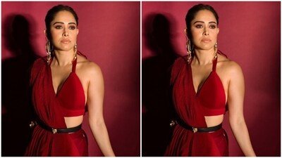 Nushrratt accessorised her look with a black belt with a golden buckle on the waist and statement golden earrings from the house of Sakshi Jhunjhunwala. (Instagram/@nushrrattbharuccha) Nushrratt accessorised her look with a black belt with a golden buckle on the waist and statement golden earrings from the house of Sakshi Jhunjhunwala. (Instagram/@nushrrattbharuccha)