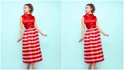 Mouni looked drool-worthy in the sleeveless red silk top with a turtle neckline, teamed with a long skirt with white and red stripes. (Instagram/@imouniroy) Mouni looked drool-worthy in the sleeveless red silk top with a turtle neckline, teamed with a long skirt with white and red stripes. (Instagram/@imouniroy)