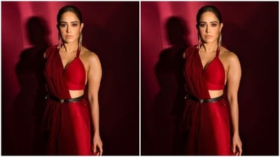 Nushrratt decked up in the stunning red silk saree and teamed it with a matching bralette featuring halter neck details and a plunging neckline. (Instagram/@nushrrattbharuccha) Nushrratt decked up in the stunning red silk saree and teamed it with a matching bralette featuring halter neck details and a plunging neckline. (Instagram/@nushrrattbharuccha)