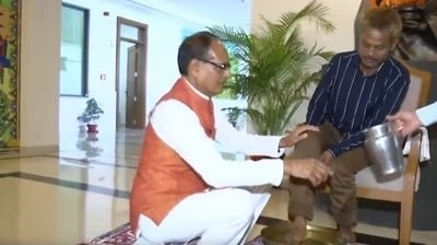 The man hesitated before giving his feet to Madhya Pradesh chief minister Shivraj Singh Chouhan as the cameras clicked the CM washing the tribal man's feet.