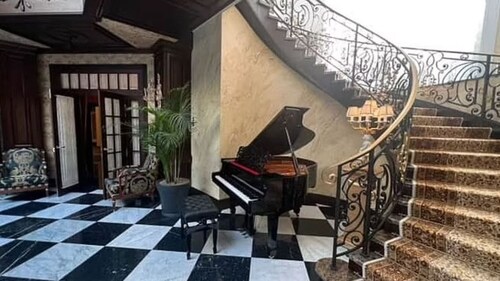 A grand staircase seen alongside a piano. (Izvestia) A grand staircase seen alongside a piano. (Izvestia)