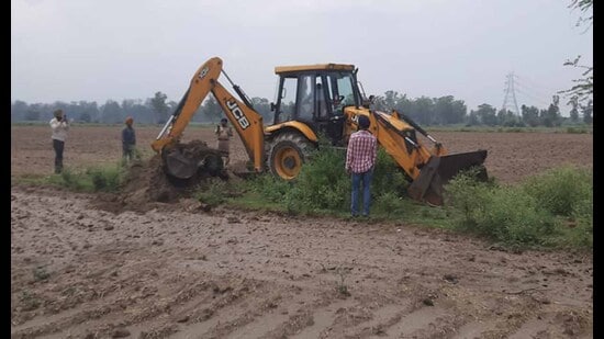GLADA removes encroachments from land in Koom Kalan in Ludhiana. (HT PHOTO)