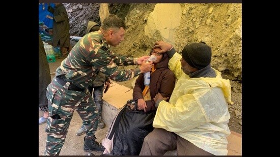 Inspector general of CRPF Ajay Yadav on Thursday rescues an Amarnath Yatra woman pilgrim. (HT photo)