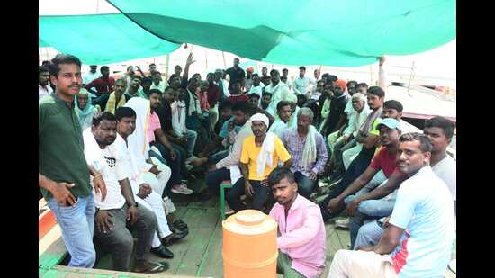 Varanasi boatmen protesting at Dashashwamedh Ghat in Varanasi on Thursday. (HT PHOTO)