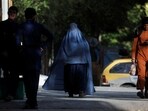 Afghanistan: An Afghan woman walks on a street in Kabul, Afghanistan.